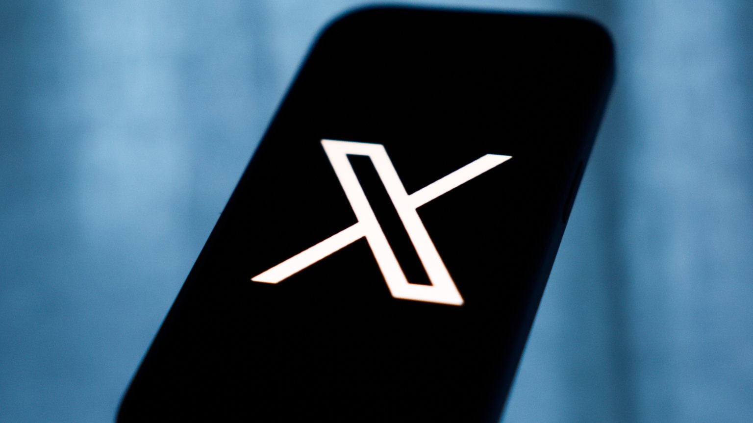 X logo on mobile device