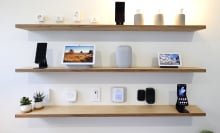 Several Google and Nest devices, including the Nest Audio speaker, Nest Hub 2nd Generation and Nest Hub Max displays, the GE Cync Wifi Soft White Smart Bulb, and the Philips Hue A19 Smart Bulb smart lightbulbs, The Philips Hue Smart Plug and the C by GE Smart Plug, exhibited on the Android Smart Home display