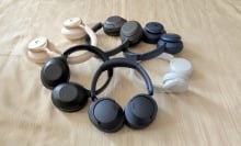 pairs of headphones piled up on each other