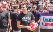 Charlie Kirk appears with supporters and security at a UC San Diego event