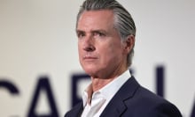 California Gavin Newsom, in profile, looks toward an audience. 