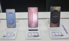 Samsung Galaxy S25 (left), Samsung Galaxy S25 Edge (center), and Samsung Galaxy S25 Ultra (right) smart mobile phones are displayed for sale at a mobile store