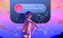 Child smiling and blowing bubbles while phone behind them is powered off. 