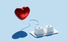 A keyboard with two keys, one marked with an "X" and the other with a check mark, is set against a blue background.