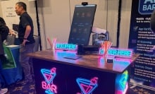 Neon covered table for an AI bartender at CES 2026.