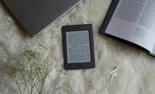 Kindle r-reader on blanket