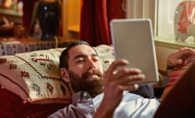Man reading Kindle