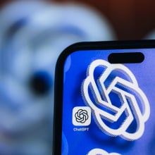 ChatGPT app appears on phone screen. 