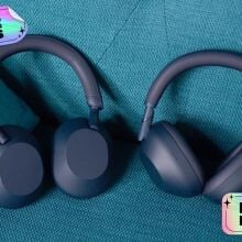 two sony headphones on a couch with stickers that read 'black friday' and 'deals'