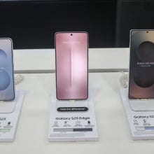 Samsung Galaxy S25 (left), Samsung Galaxy S25 Edge (center), and Samsung Galaxy S25 Ultra (right) smart mobile phones are displayed for sale at a mobile store