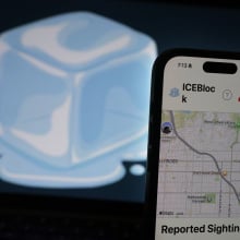 A large illustration of an ice cube behind an iPhone displaying the ICEBlock app.