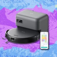 eufy c10 robot vacuum against a purple and blue patterned background