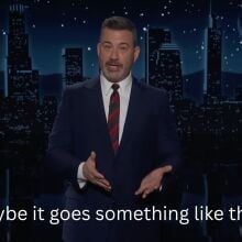 A man stands on a talk show stage. The caption at the bottom reads, "Maybe it goes something like this..."