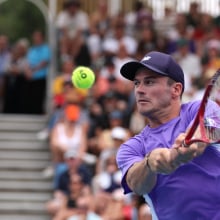 Tommy Paul hits a return in the Australian Open