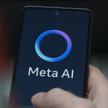 A Meta AI logo on a smartphone.