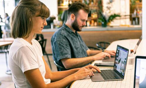 Two people working at desk
