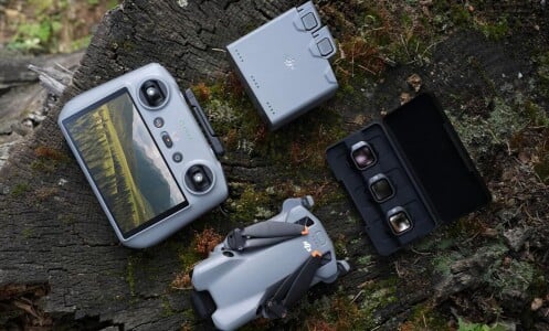 the DJI Mini 5 Pro Fly More Combo sitting outside with extra batteries and RC 2 remote