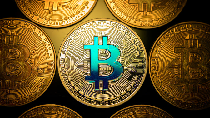 Coins with the bitcoin logo.