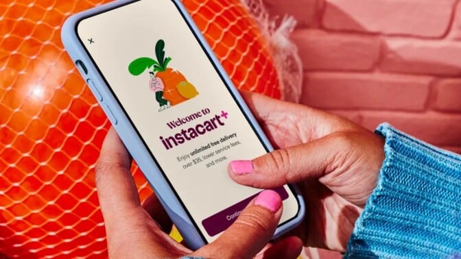 a person uses a cell phone to sign up for instacart+