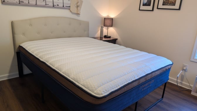 the brooklyn bedding copperflex pro mattress in a bedroom with a nightstand