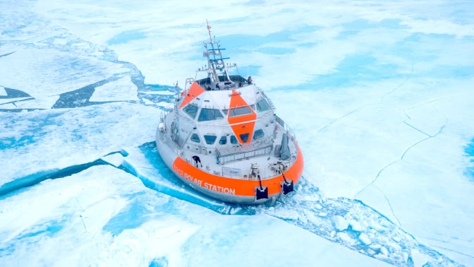 A drone image shows the Tara Polar Station up in the Arctic, surrounded by ice