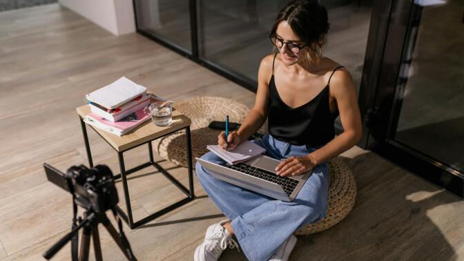 Woman studying on floor