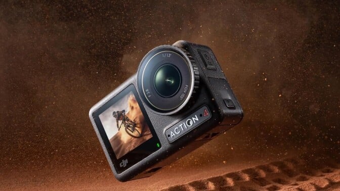 the DJI osmo action 4 camera falling into red-ish dirt that has a bike tire track