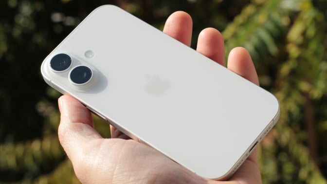 the iphone 17 held in hand with cameras showing