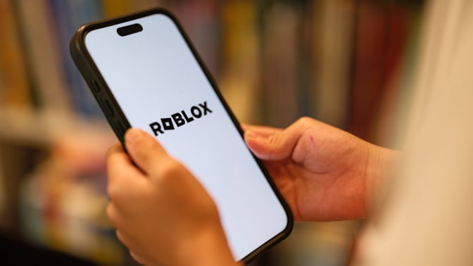 Roblox logo on mobile device