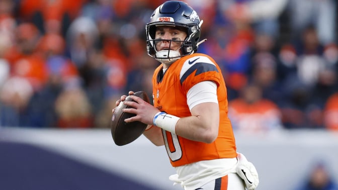 Bo Nix of the Denver Broncos looks to pass 