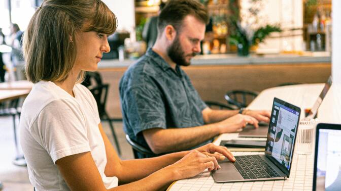 Two people working at desk