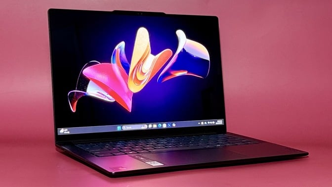 the Lenovo Yoga Slim 7x against a red background