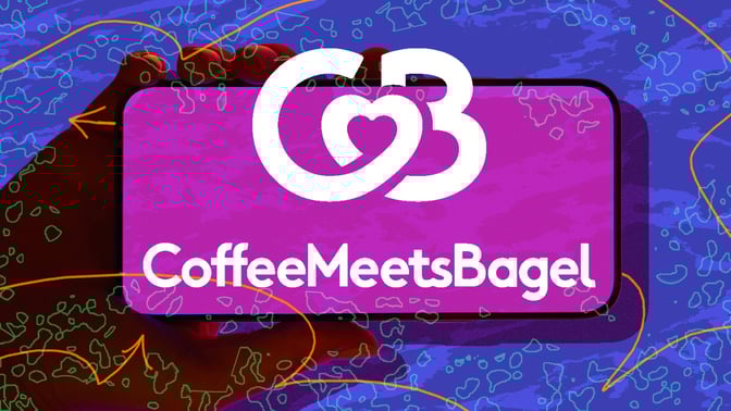 Hand holding phone with CoffeeMeetsBagel logo against abstract background