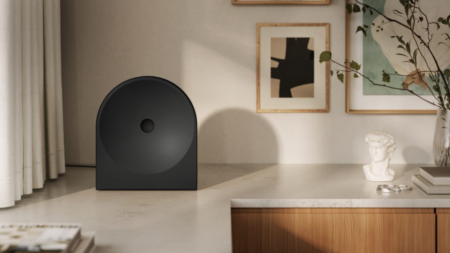 Samsung's new WiFi speaker system sitting on a white countertop.