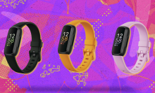 Fitbit Inspire 3 in black, yellow, and pink with colorful purple and pink background
