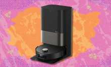 Dreame X50 robot vacuum and mop on pink and orange abstract background