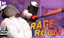 Kristy Puchko smashing products at the Pluto TV Rage Room