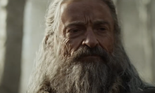 A close-up of a bearded man with long hair.