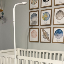 tall scope-like baby monitor looking over crib
