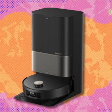 Dreame X50 robot vacuum and mop on pink and orange abstract background