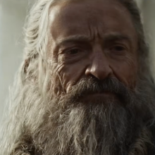A close-up of a bearded man with long hair.