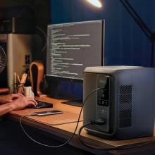 man working on computer hooked up to EcoFlow Delta 3 1000 Air