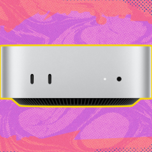 The Apple Mac mini (M4) against a pink background. 