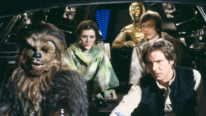still from Star Wars movie with han solo, chewbacca, luke skywalker, princess leia, and c-3p0 in millennium falcon