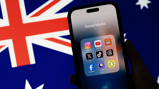 Social media networking apps are displayed on a phone screen with the Australian flag displayed in the background.