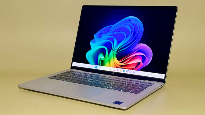 the HP OmniBook 5 14 against a pale yellow background